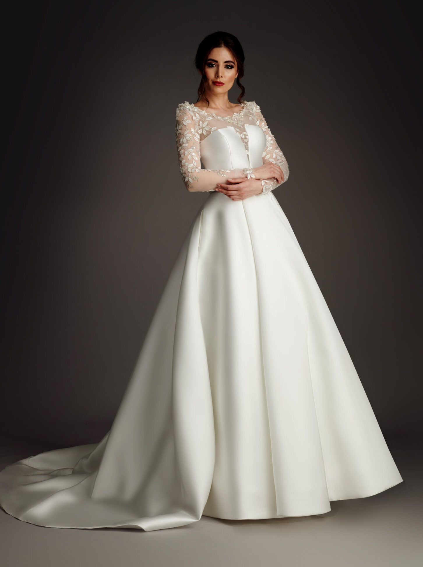 Sophisticated and elegant mikado ballgown with draped sleeve and diamante beading