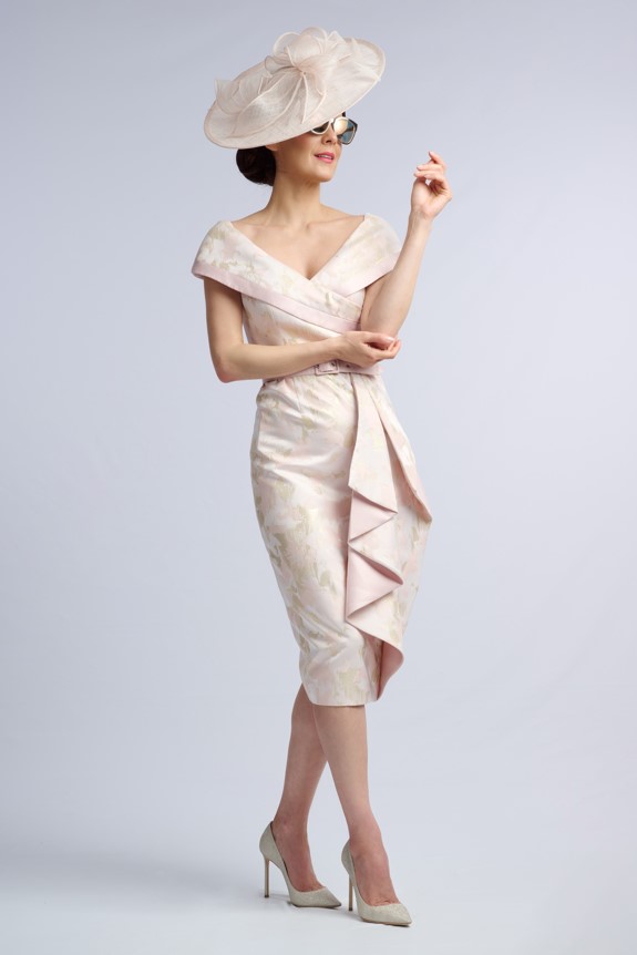 Model in the Salisbury blush and gold jacquard occasion dress with portrait collar and draped front panel
