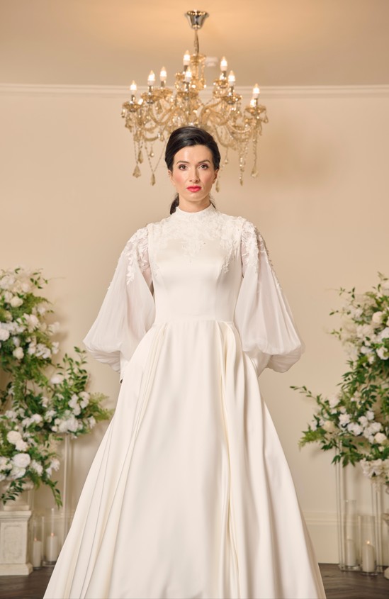 Elegant ivory mikado V neck ballgown with beaded detail and pockets