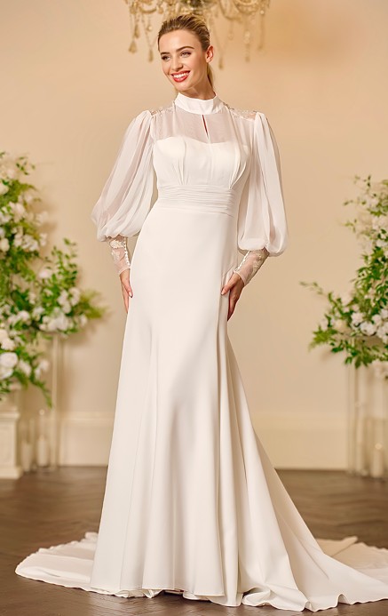 Back view of the Tatum ivory crepe one-shoulder wedding dress with a deep V back, single long sleeve, covered buttons down the centre back and a softly draped A-line skirt with train.