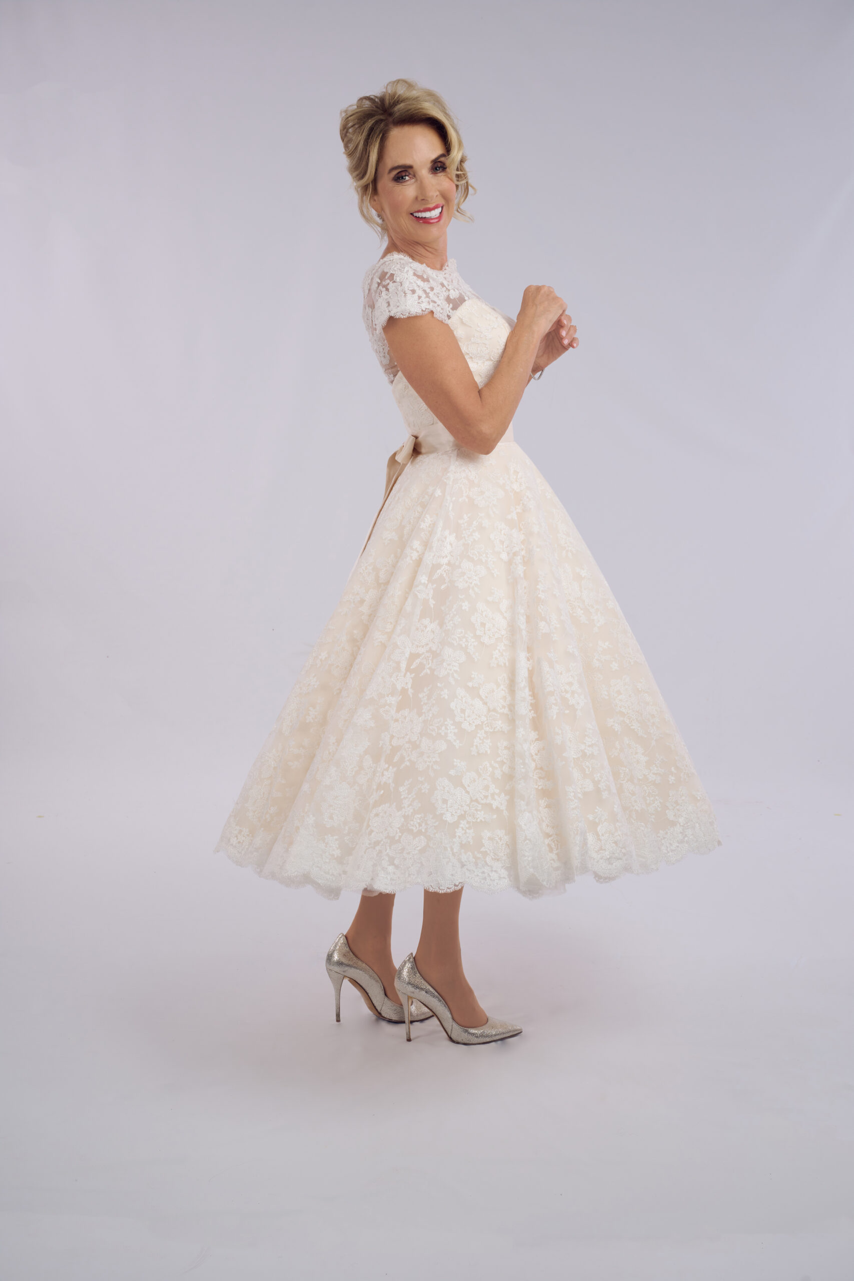 Sarah all-over lace ballerina length wedding dress for older brides, with an off-the-shoulder neckline and full skirt