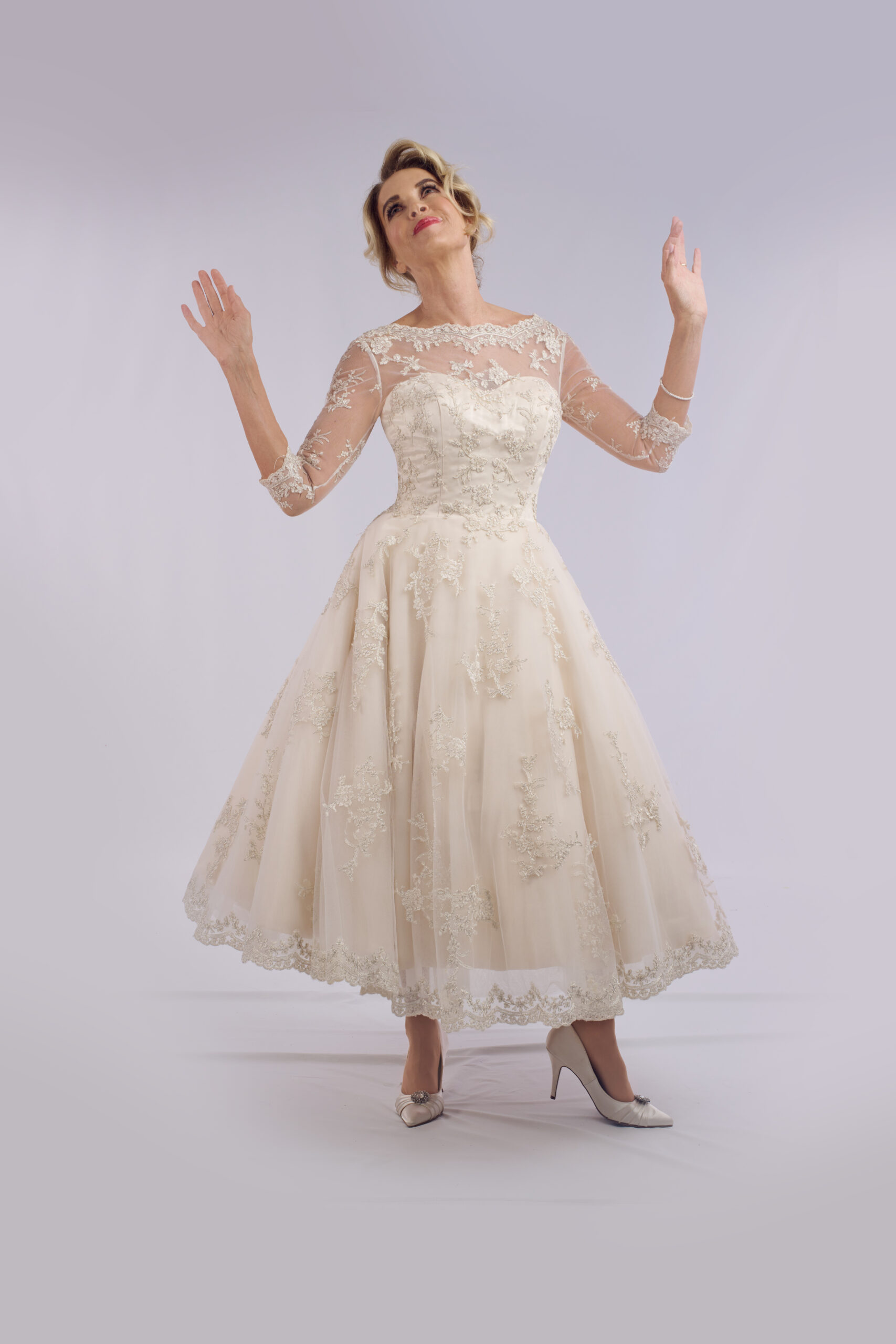 Frances champagne lace ballerina length wedding dress for older brides, with an illusion neckline and sheer sleeves