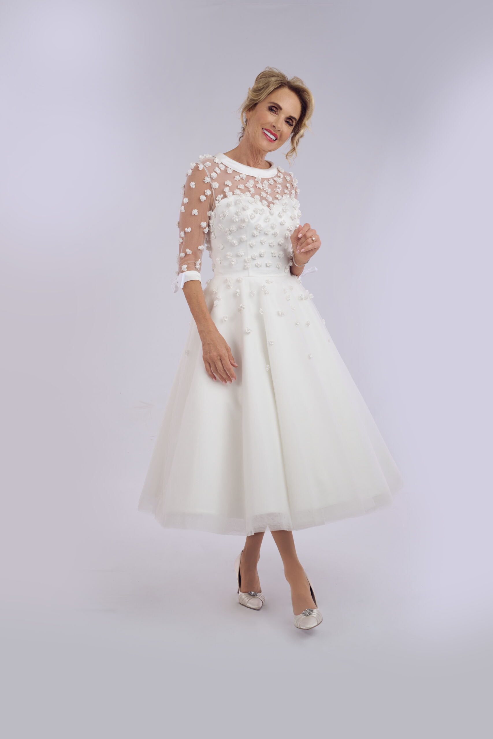 Posie 3D floral ballerina length wedding dress for older brides, with an illusion neckline and sheer sleeves
