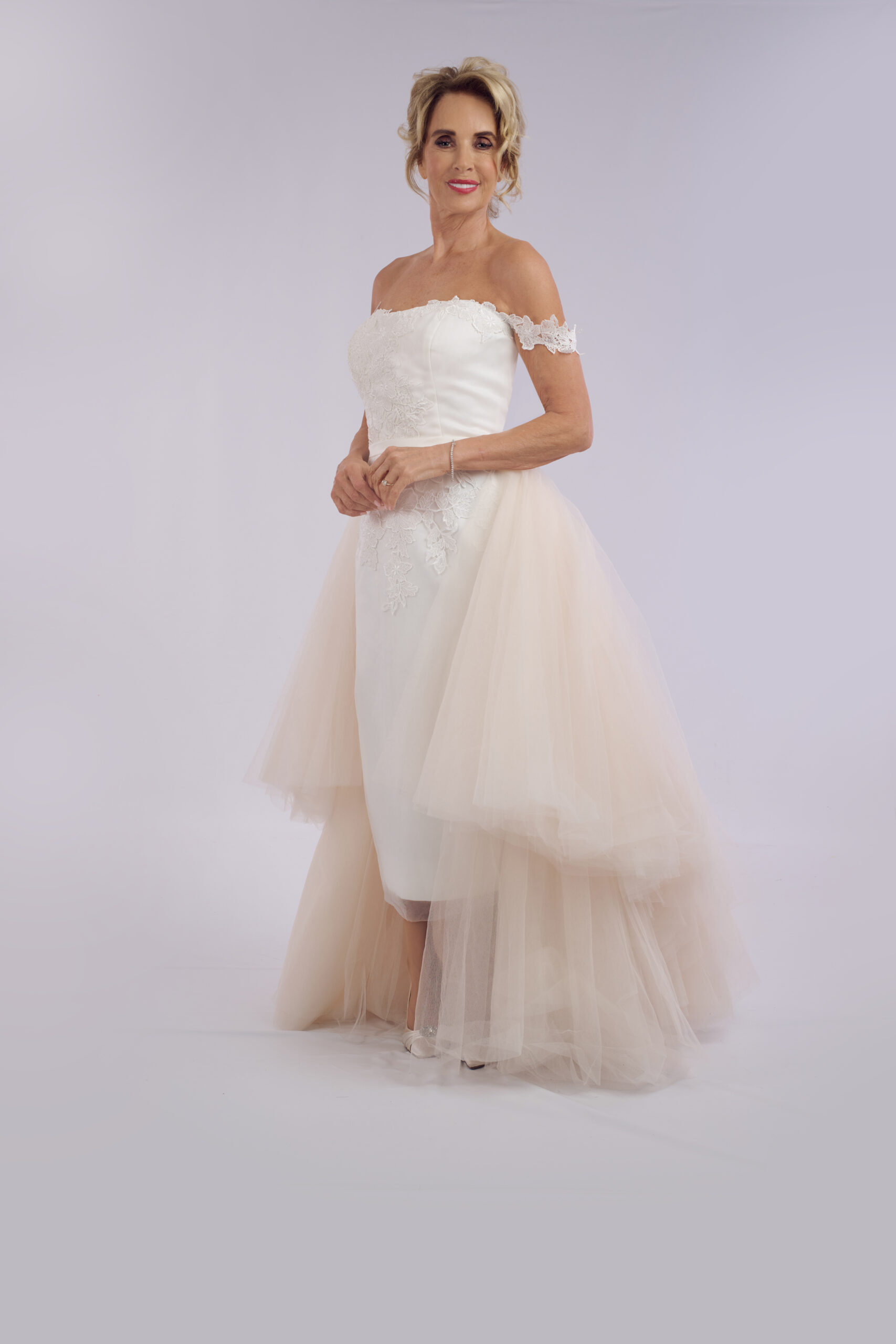 Sophia off-the-shoulder lace wedding dress for older brides, with a detachable tulle overskirt