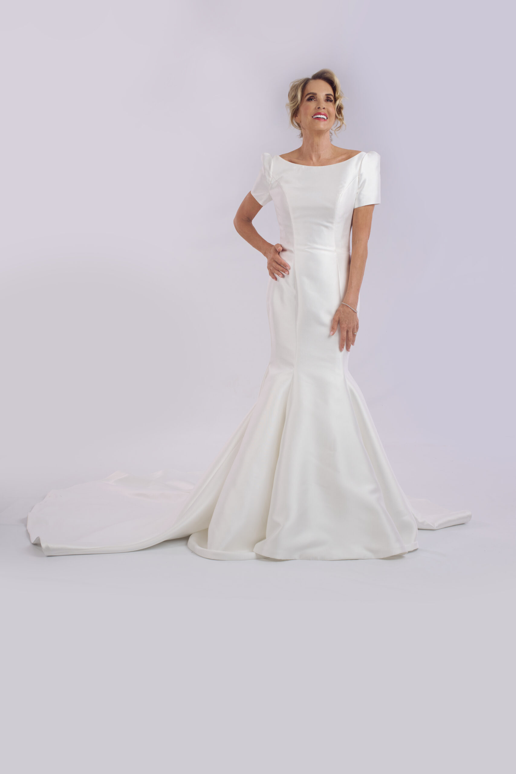 Tyra mikado fishtail wedding dress for older brides, with a boat neckline and statement sleeves