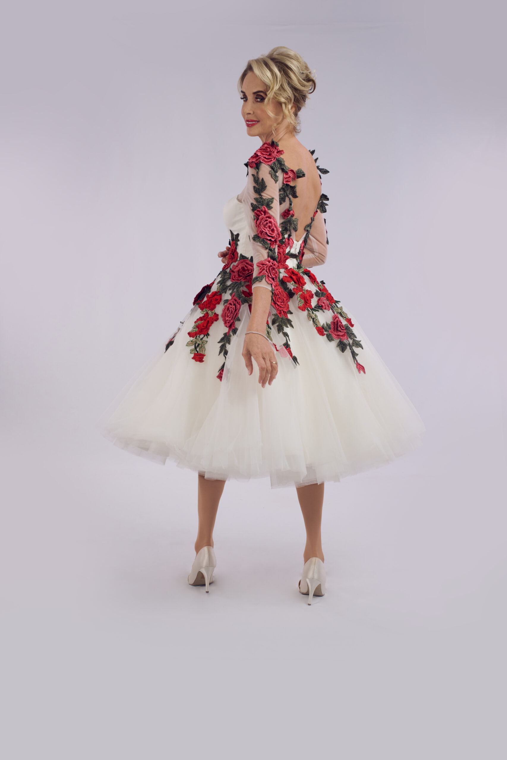 Valentine floral tea length wedding dress for older brides, with cascading 3D red roses and illusion sleeves